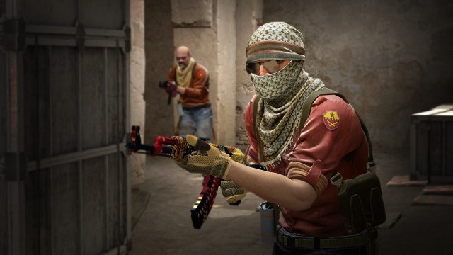 Two Terrorists in CS:GO with guns in hands.