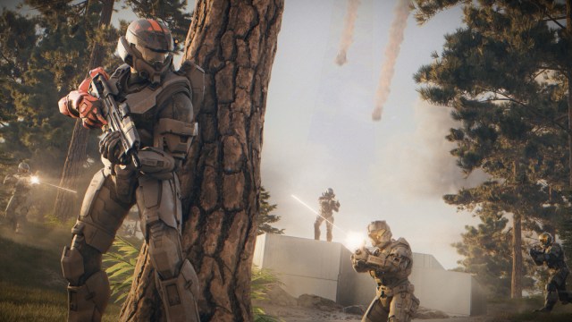 Halo characters locked in battle in the woods.