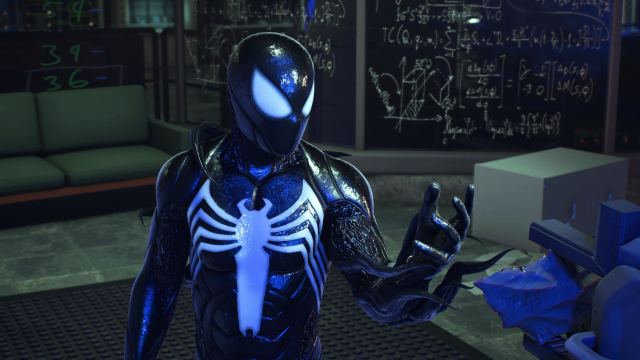 Peter Parker in the Symbiote suit in Spider-Man 2 reaching for an object.