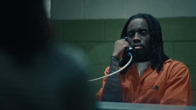 Kai Cenat on the phone in prison during the stream trailer.