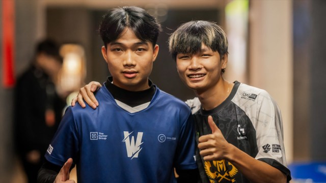 Artemis (L) from Team Whales and Kati (R) from GAM Esports, pose backstage with their thumbs up ahead of their match at the League of Legends World Championship.