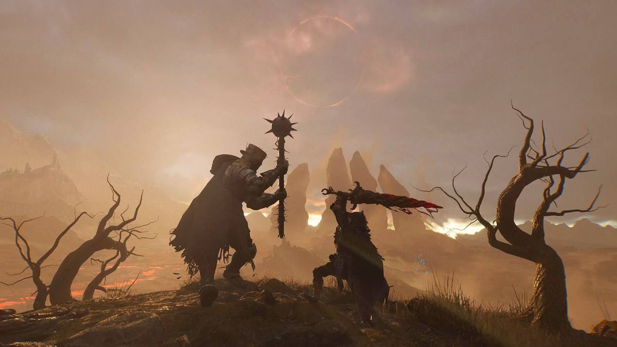 A warrior with a sword fighting a knight with a mace in Lords of the Fallen with the eclipse in the background