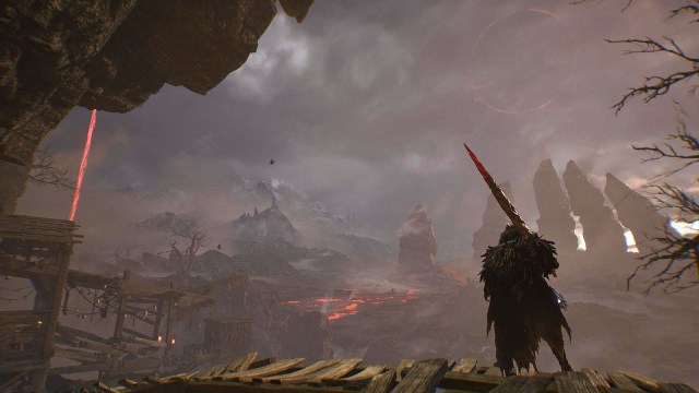A warrior stands with a sword staring out across the plains in Lords of the Fallen.