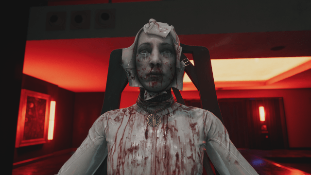A dead woman looking at the camera in a red room in Dead Island 2